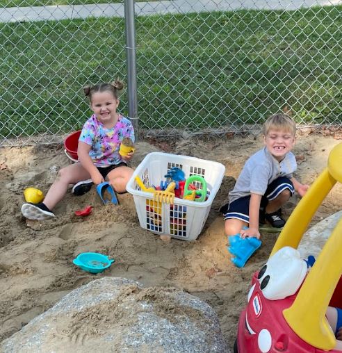 Mrs. Smith's class playing in the sandbox